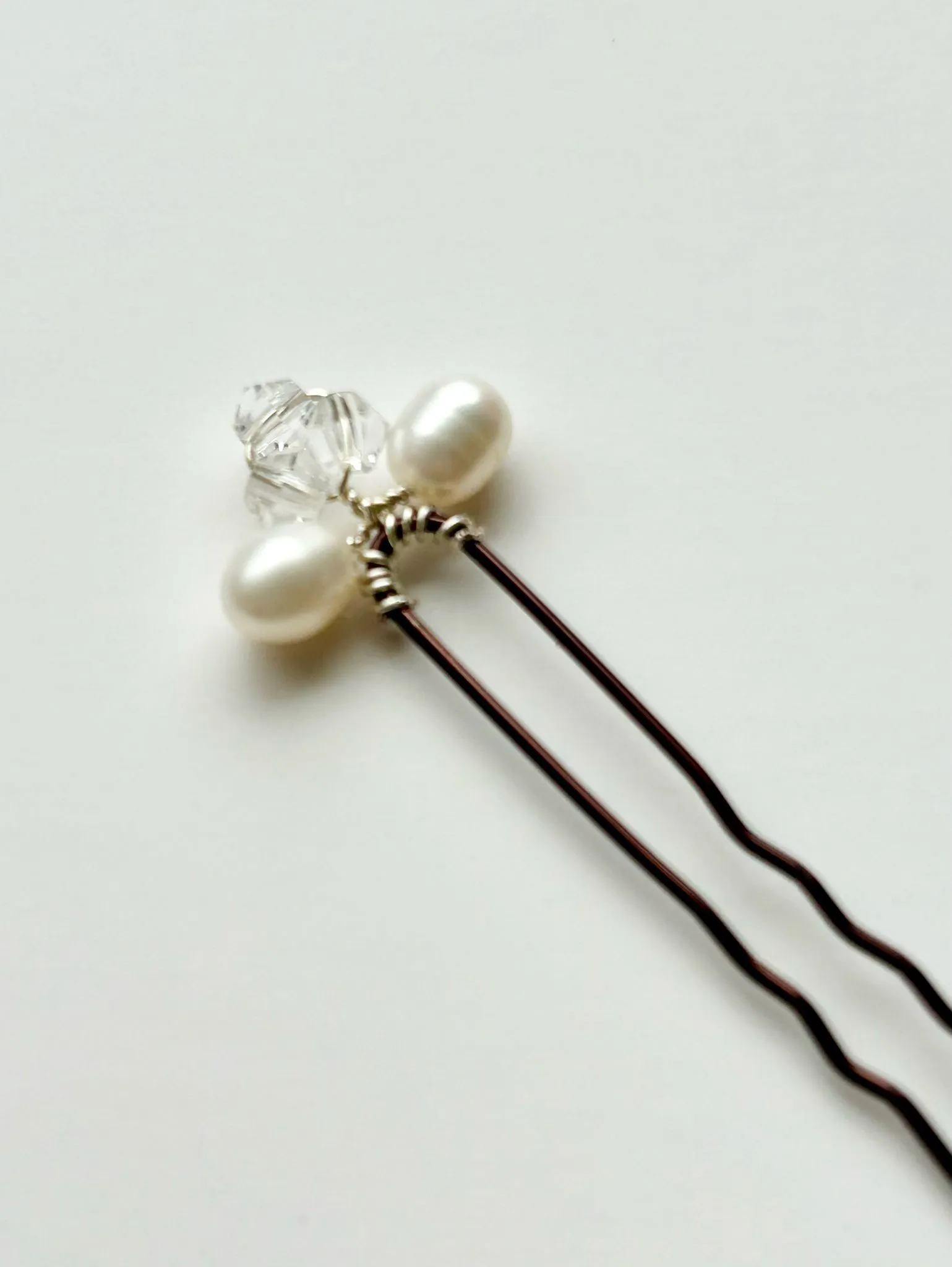 Pearl and crystal hair pin close-up